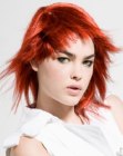 Red hair with forward layering and razor-cut ends