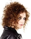 Medium length haircut with layering and wild curls