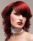 Fire red hair with a sleek top and curly sides