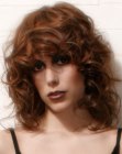 1980s inspired hairstyle with curls and thick bangs