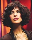 Dark reddish hair with curls and short bangs