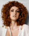 Coppery shoulder length hair with curls