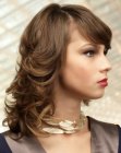 Medium hairstyle with curls and a 1970s flair