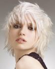 Platinum blonde hair with layers and windswept strands