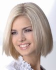 Blonde mid-length bob haircut with razor-softened ends