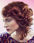 Red hairstyle with twirled and twisted curls