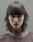 Neck-length bob with razor-cutting and horizontal bangs