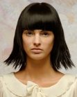 Bob haircut with razored ends and heavy bangs