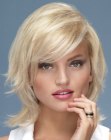 Blonde medium length hairstyle with flipped sides
