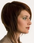 Midl-length hairstyle with a shorter back and textured ends