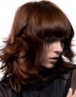 Medium length haircut with energetic outward flips