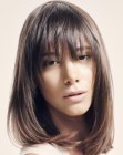 Sleek shoulder length bob with texture around the face