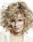 Blonde hair with curls of various shapes and sizes