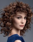 Medium long hair with spiral curls and short bangs