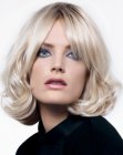 Classic medium hairstyle with volume and open bangs
