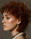 Neck-length wet look hairstyle with curls