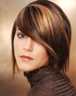 Medium length hairstyle with highlights and a side-fringe