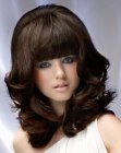 1960s retro hair with curls and long bangs