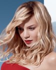 Long blonde hairstyle with twisted bangs