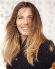 Long hair with a color transition from dark to lighter blonde
