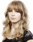 Romantic girly hairstyle with bangs and curls