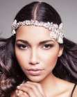Simple long hair and a headpiece with floral shapes
