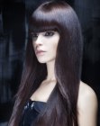 Sleek long hair with full sides and thick bangs