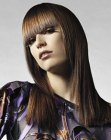 Long and straight shiny hair with blunt cut bangs