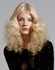 Long blonde hairstyle with permed curls