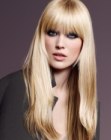 Long hairstyle with long layers and thick bangs