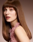 Long straight hair with rounded 1970s bangs