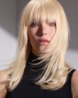 Long blonde hair with full bangs