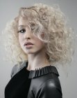 Curly blonde hair with warm and cool tones