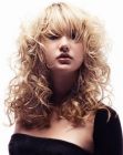 Blonde hair with spiral curls and smooth bangs