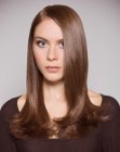 Sleek long hair with a 1960s flip