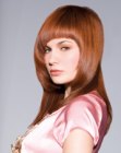 Sleek face framing hairstyle with arched bangs