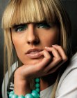 Blonde hair with broad blunt cut bangs