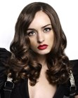 Long hairstyle with off center parting, curls and waves