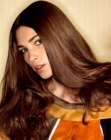 Long saddle brown hair with curled ends