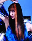 Long dark hair with orange streaks and full bangs