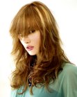 Hairstyle with long bangs and tousled curls