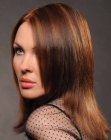 Sleek chestnut brown hair with caramel streaks