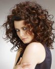 Long layered hairstyle with waves and spiral curls