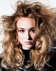 Long hairstyle with large curls and dramatic volume