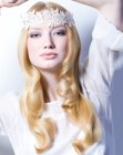 Long wedding hair with barrel curls and a lace headband