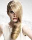 Long blonde hairstyle with one large curl