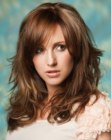 Over-shoulder length chestnut brown hair with layers