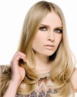 Long hair with a center part and 1960s elements