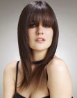 Razor-cut brunette hair with smooth and slick lines
