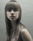 Sleek long hair with curved sides and bangs
